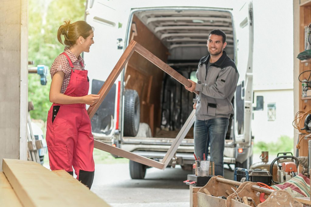 Couple emptying a trade van