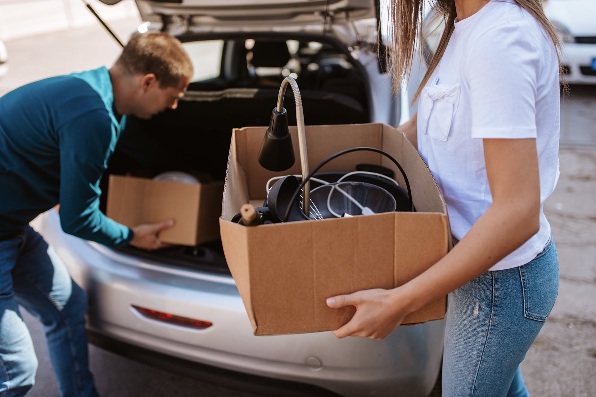 Couple unpacking car