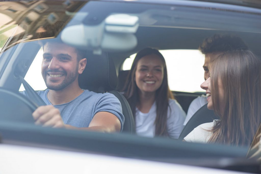 image of four friends in a car