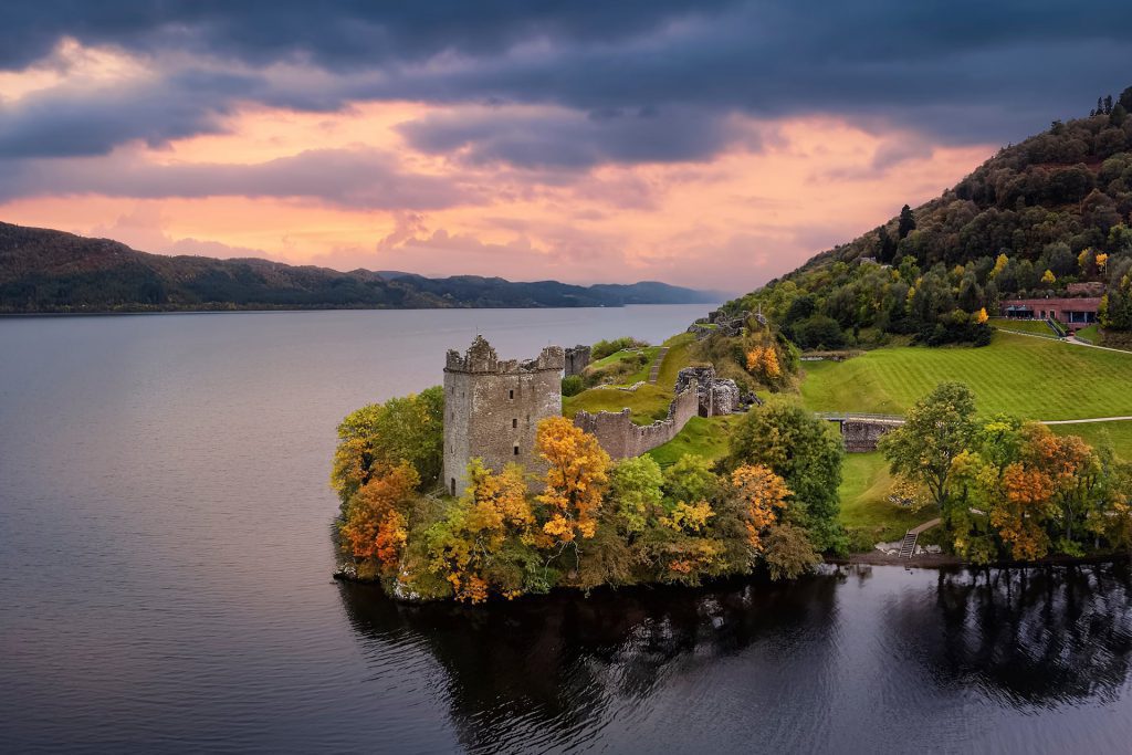 Castle ruins next to a loch