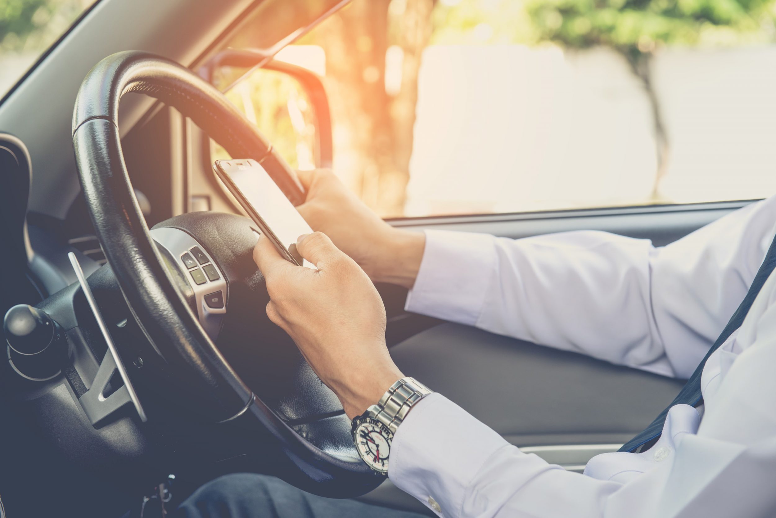 Image of driver using a mobile phone