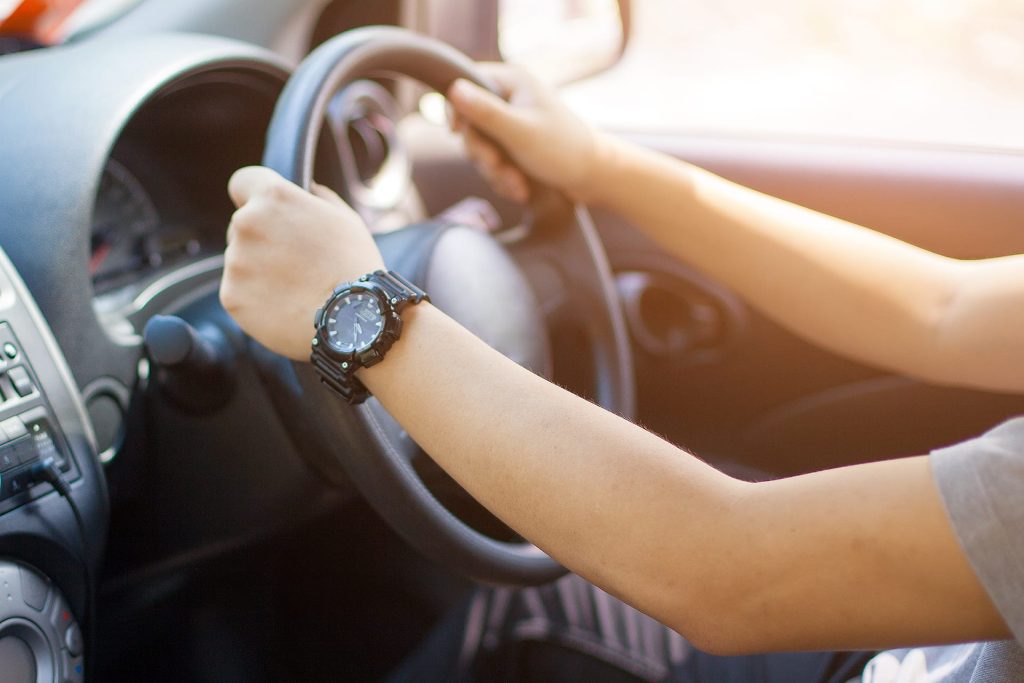 Learner driver holding the steering wheel